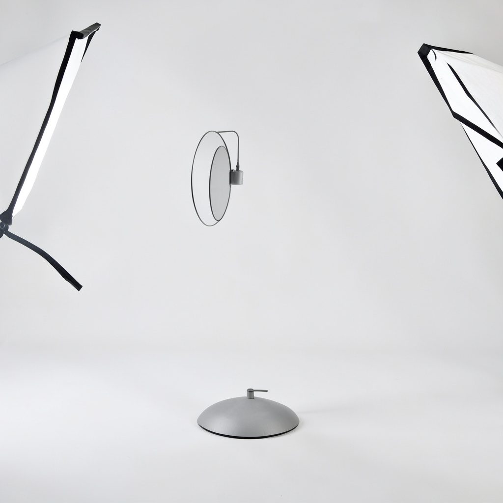 A studio shot of a dark neoprene garment laid flat on a neutral backdrop, simple and product-focused.