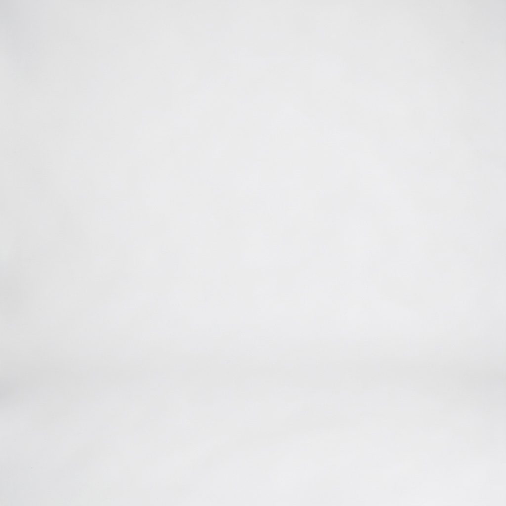 Studio photograph of a paddleboard laid flat on a soft neutral backdrop, ocean blue gradient